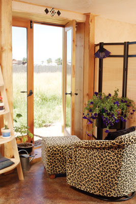 Emmanuelle purchased the leopard-print chair so she would have a place to sit while breastfeeding her son. “I didn’t want something that looked too Granny,” she says. “I wanted something fun.” The chair, in Emmanuelle’s lower-level studio, faces the south where it’s always sunny.